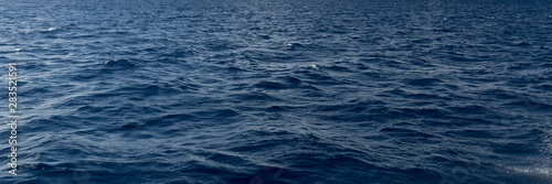 Panoramic texture of sea water in the open blue ocean © zoommachine