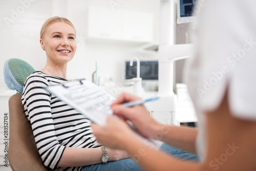 Patient smiling being thankful after dental treatment.