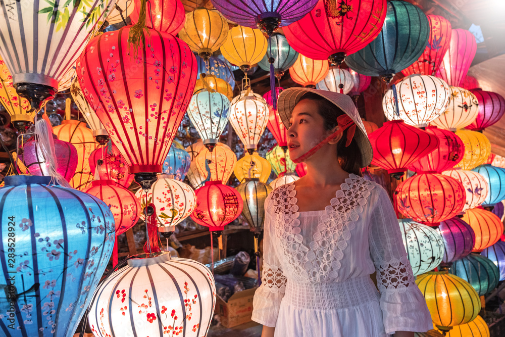Travel woman choosing lanterns in Hoi An, Vietnam
