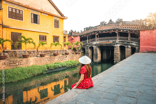 Travel woman with Japanese Covered Bridge,  in Hoi An, Vietnam
