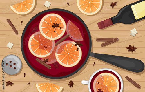 Red mulled wine in a pot with orange slices, cinnamon, cloves and a bucket. White mugs of mulled wine. Flat lay.
