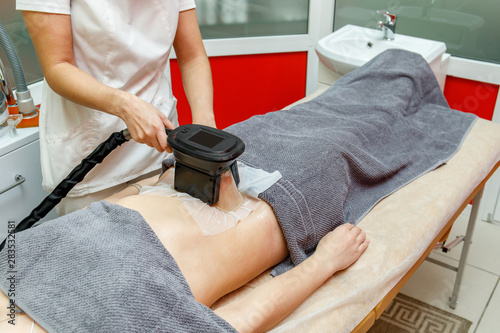Cryolipolysis fat freezing treatment. Weight loss and slimming procedure photo