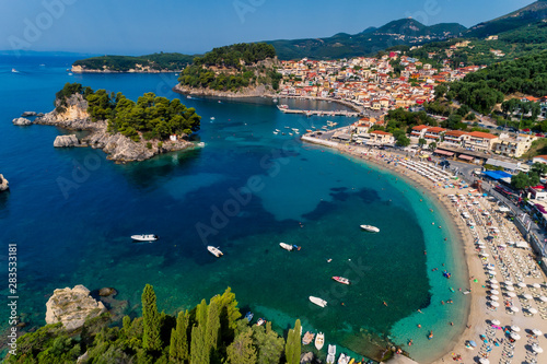 Aerial cityscape view of the coastal city of Parga, Greece during the Summer © ververidis