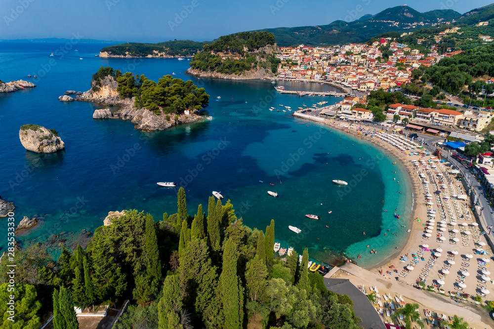 Fototapeta premium Aerial cityscape view of the coastal city of Parga, Greece during the Summer