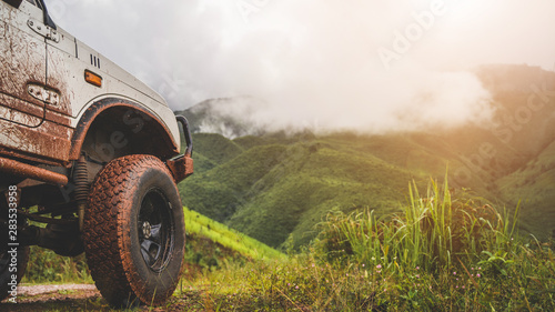 Off road vehicles that smear mud on the mountain trail