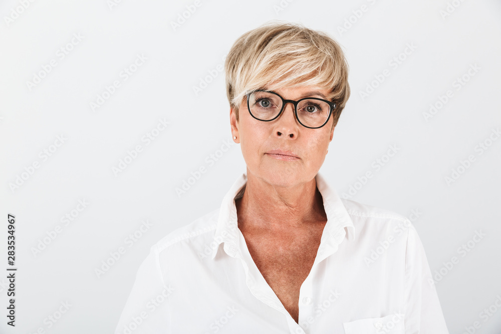 Portrait of caucasian adult woman wearing eyeglasses looking at camera Portrait of caucasian adult woman wearing eyeglasses looking at camera
