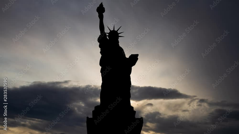 Statue of Liberty: Time Lapse at Sunsrise, Manhattan, New York, USA Statue of Liberty: Time Lapse at Sunsrise, Manhattan, New York, USA