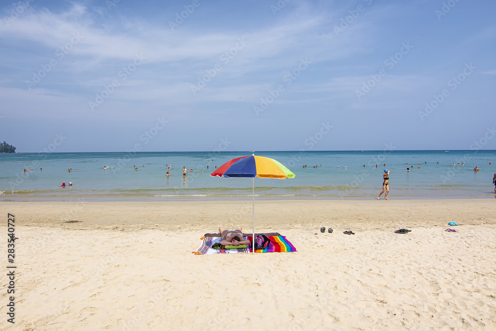 Travelers rest on the canvas bed, Kran Beach on March 28,2018 in Phuket,Thailand