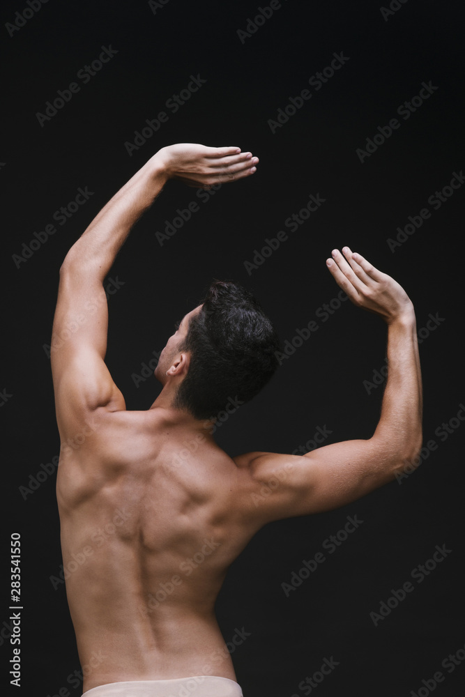 Anonymous male dancing with raised arms Anonymous male dancing with raised arms