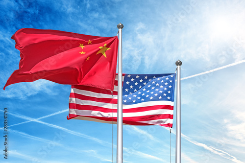 Fotografie, Obraz china and usa national flag waving against clouds blue sky side view of natural