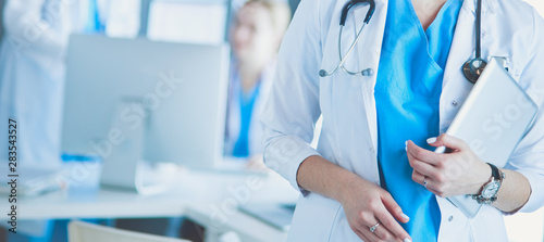 Εκτύπωση καμβά Female doctor using tablet computer in hospital lobby