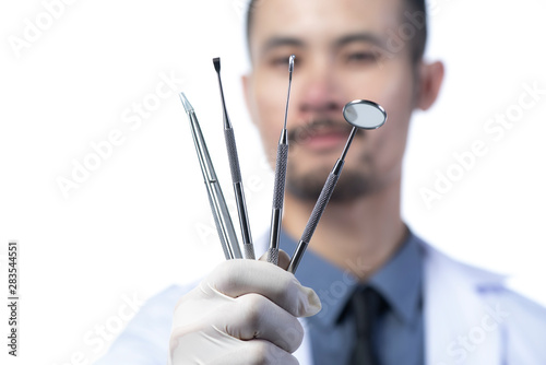 dentist with Dental tools isolated on white background