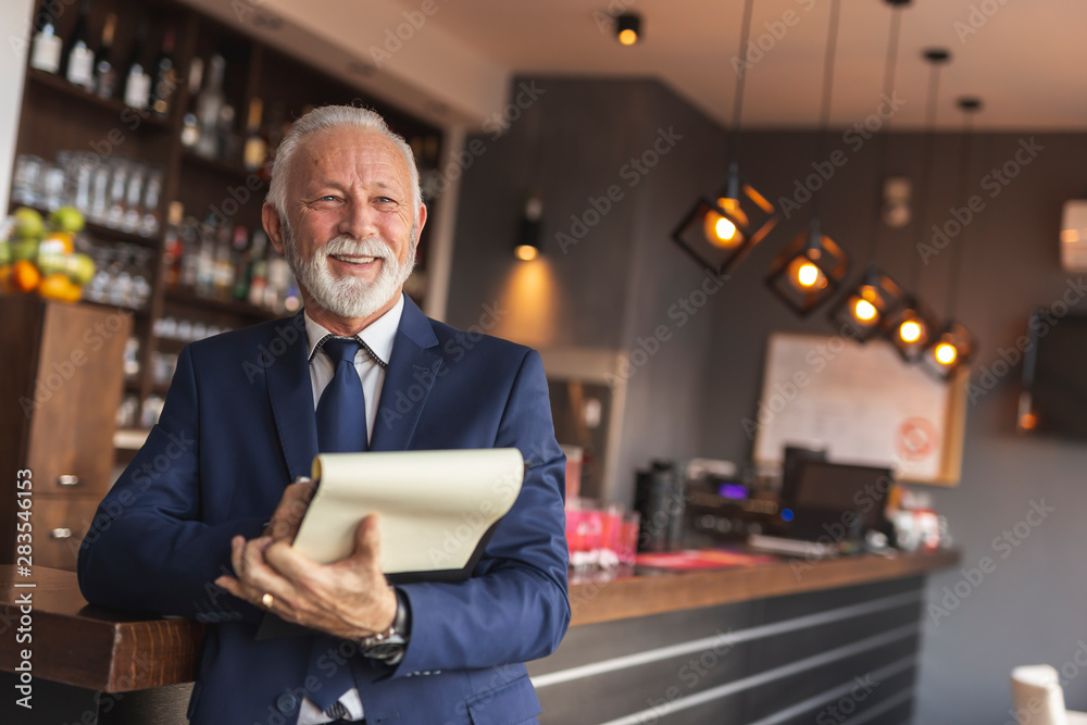 Senior businessman analysing procurement contracts Senior businessman analysing procurement contracts