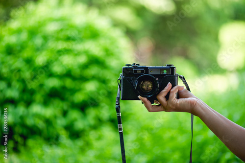 Hand and camera Of professional photographers Concept photographer