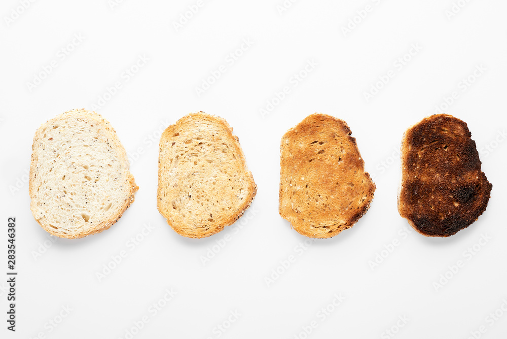 Croutons of different roasting. White background. Croutons of different roasting. White background.