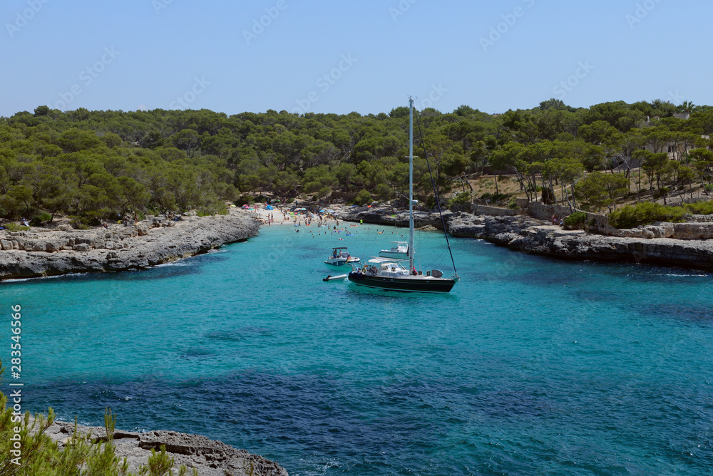 sailing yacht in a beautiful blue lagoon