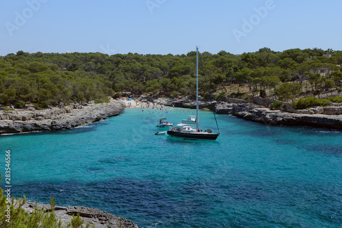 sailing yacht in a beautiful blue lagoon