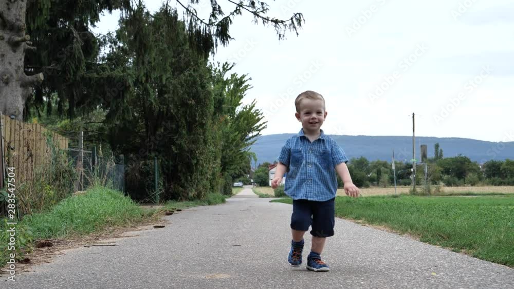 Attractive Cute Young Child Boy Running With Fun Show with finger Up Attractive Cute Young Child Boy Running With Fun Show with finger Up