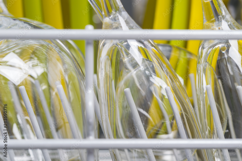 glass yellow and green plates, background of clean kitchen utensils