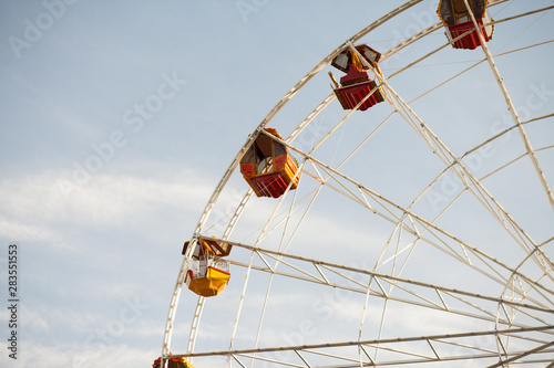 Ferris wheel over blue sky in the park