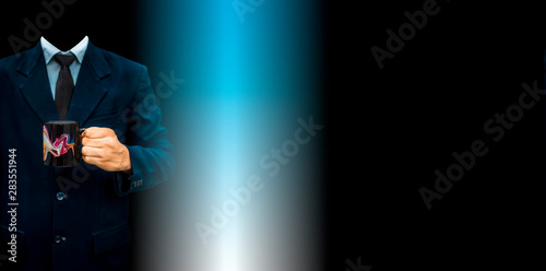 Fototapeta Naklejka Na Ścianę i Meble -  The young unidentifiable gentleman holding a black colored coffee mug in his hand. Concept of Corporate lifestyle against blue and white mixed colors background.