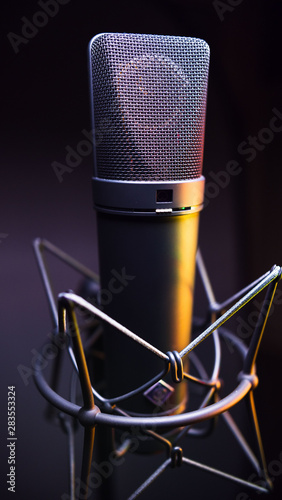 studio condenser microphone, with gradient background and amber light photo