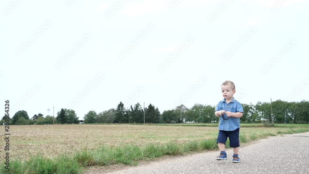 Attractive Cute Young Child Boy Walking Alone and Start to Running Attractive Cute Young Child Boy Walking Alone and Start to Running