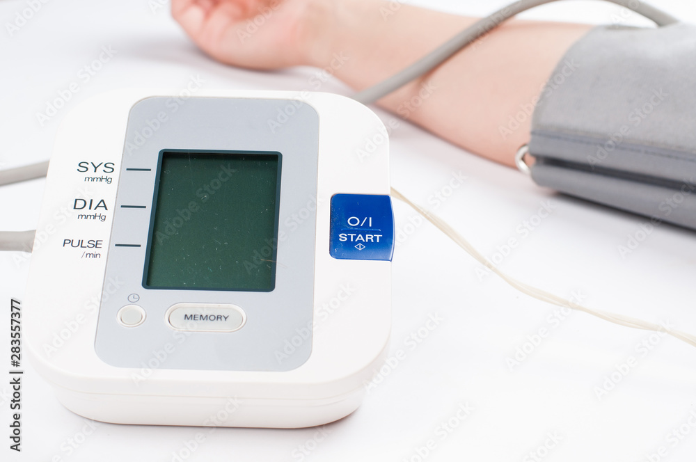Blood pressure monitor isolated on white background. Medical equipment.Copy space Blood pressure monitor isolated on white background. Medical equipment.Copy space