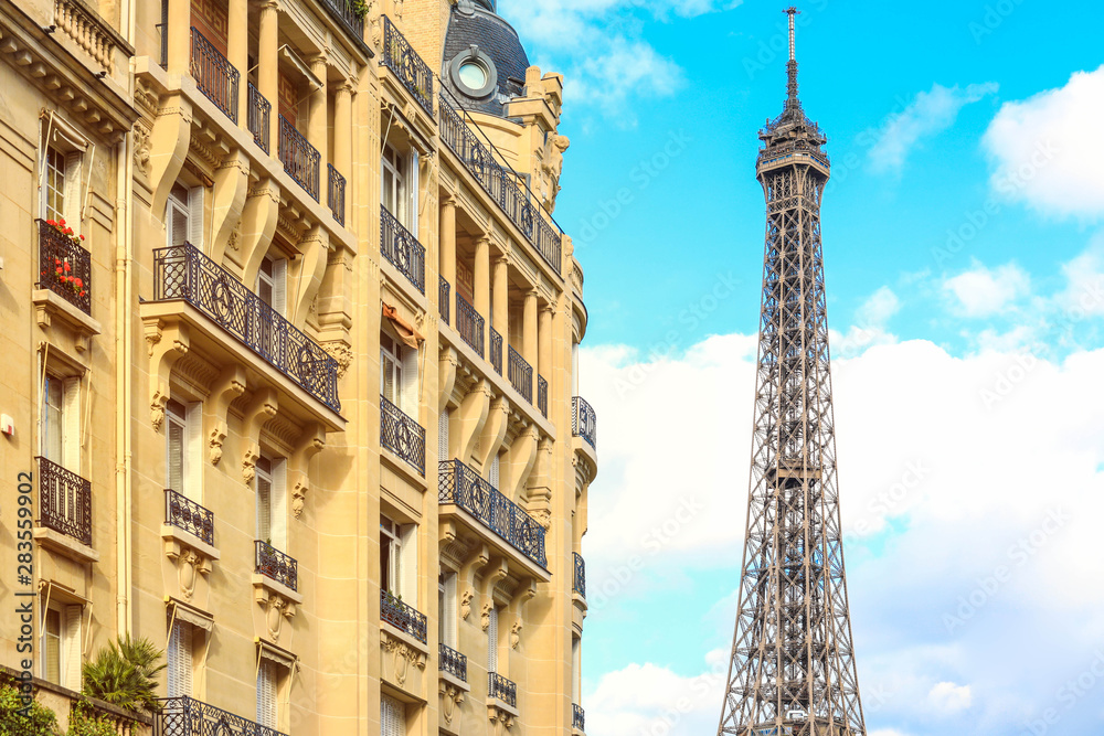 View ofEiffel Tower in Paris between city buildings, France