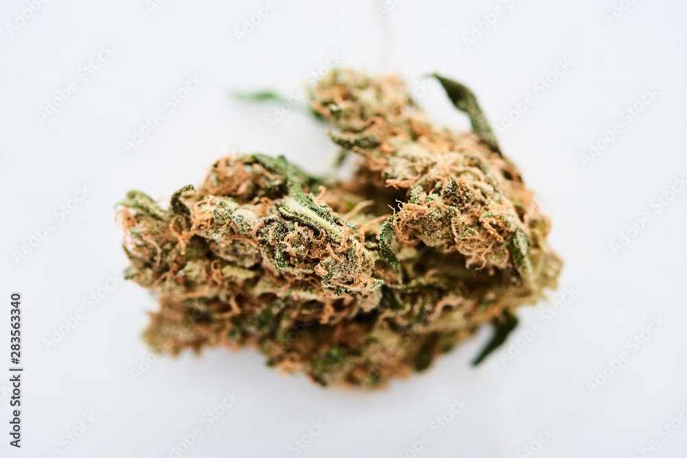 close up view of natural marijuana bud isolated on white close up view of natural marijuana bud isolated on white