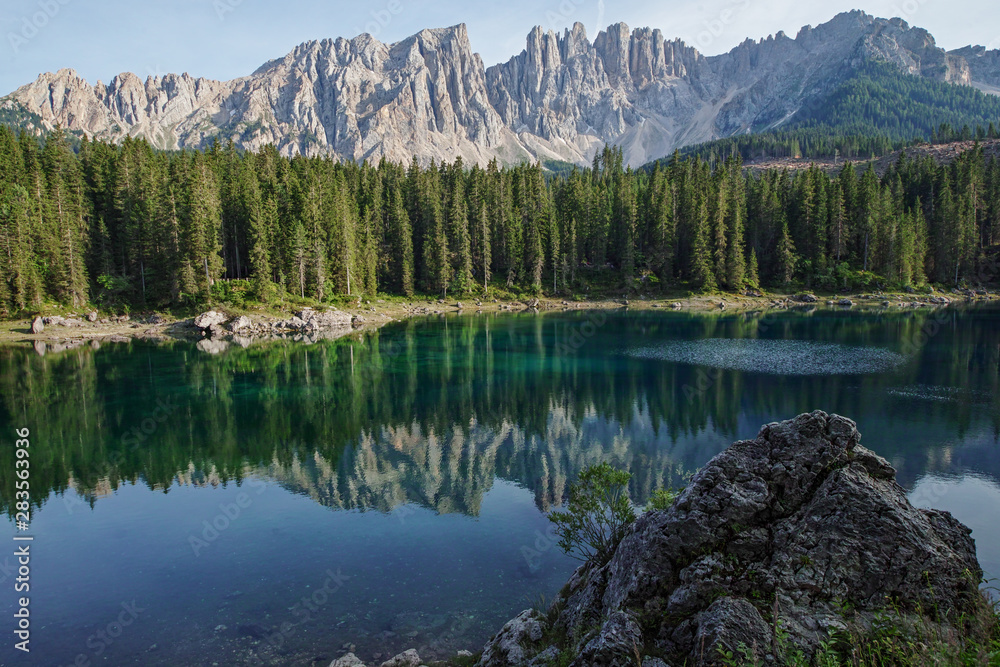 Fototapeta premium view over the Karer See to the mountain range Latemar