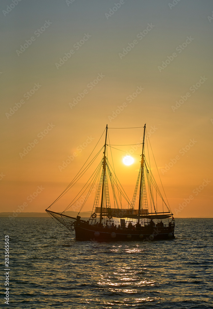Ship sailing in the Sunset of  Zadar. Croatia. Europe