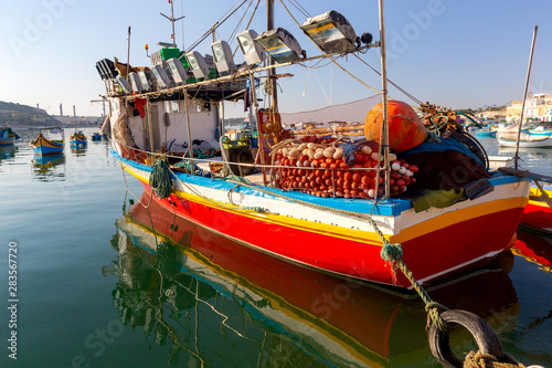 Marsaxlokk. Traditional boats Luzzu in the old harbor. photo