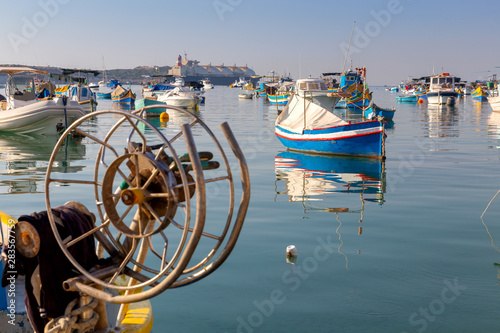 Marsaxlokk. Traditional boats Luzzu in the old harbor. photo