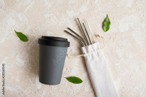Reusable eco friendly sustainable handy bamboo cup and stainless steel metallic straws. Zero waste © Iryna