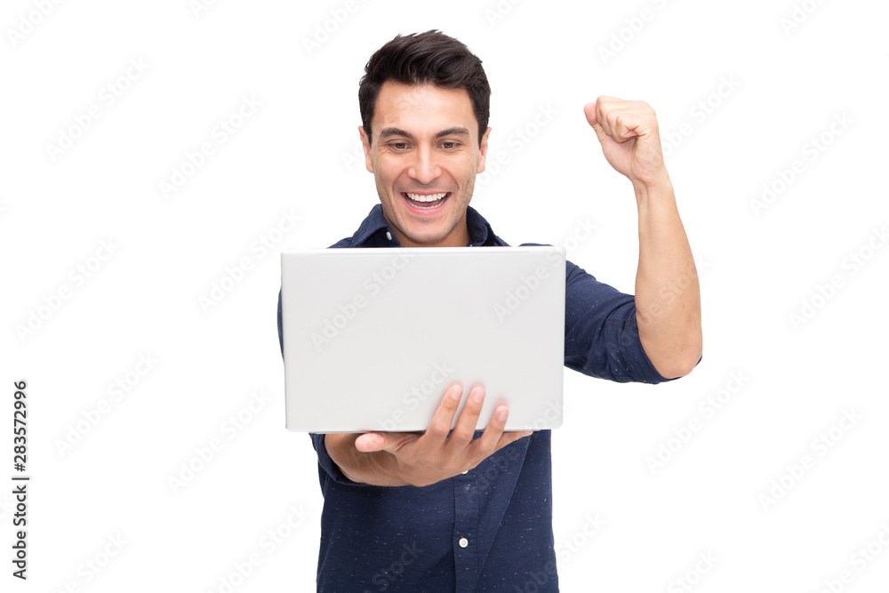 Portrait of an excited man holding laptop computer and celebrating success over white background, Raising arms with a look of happiness, Male model Portrait of an excited man holding laptop computer and celebrating success over white background, Raising arms with a look of happiness, Male model