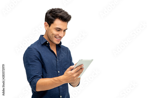Obraz na płótnie Happy young man using digital tablet isolated on white background