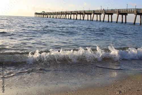 Morning waves by the pier at Dania Beach, Florida. photo