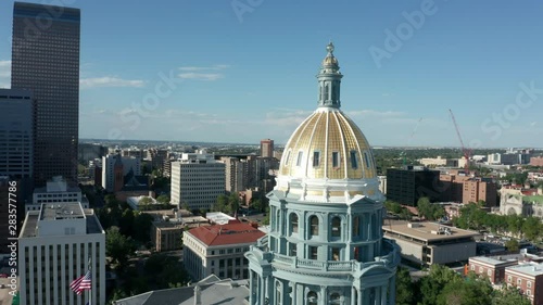 alt flying counter clockwise around Colorado statehouse revealing Denver skyline photo