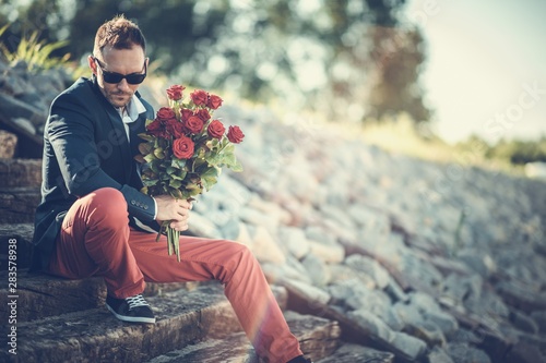 Men with Bouquet of Roses photo