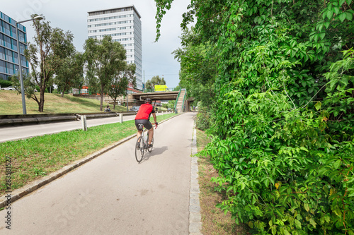 Man riding a bicycle at the lane in big city