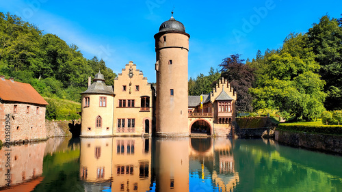 Medieval Mespelbrunn Castle in Bavaria, Germany with late day reflections in the moat photo