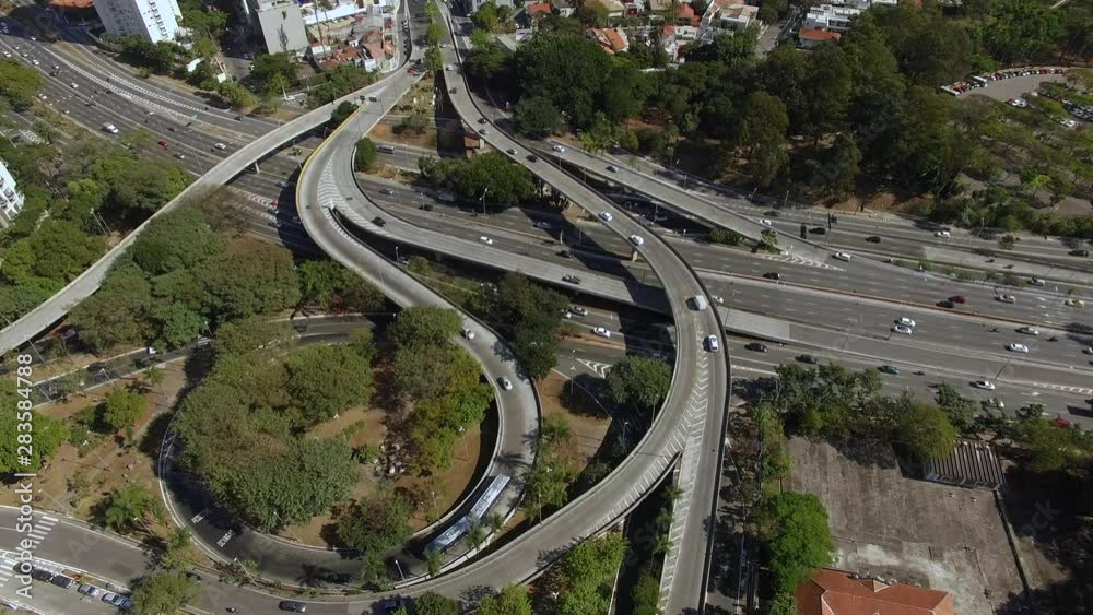 Aerial view of highway and overpass in city. Top view city traffic of highway and bridge, logistics. Sao Paulo city, Brazil. South America. Aerial view of highway and overpass in city. Top view city traffic of highway and bridge, logistics. Sao Paulo city, Brazil. South America.