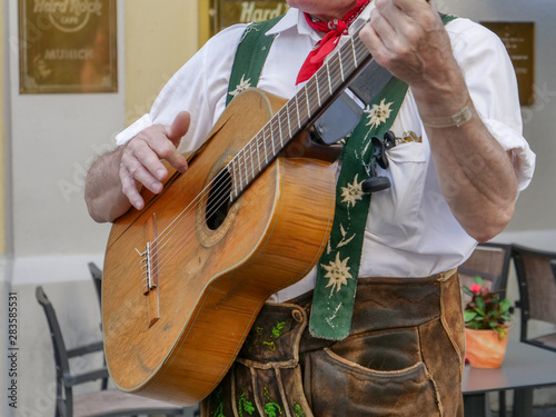 German Oktoberfest style lederhosen clothing and guitar, Munich, Germany, August 2nd 2019