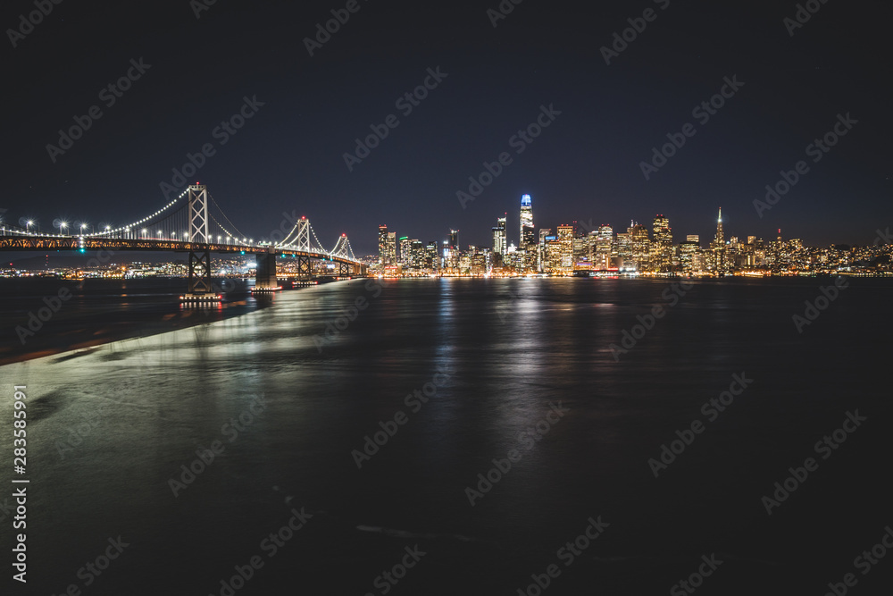 Panoramic beautiful scenic view of the Oakland Bay Bridge and the San Francisco city in the evening, California