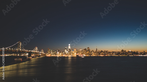 Panoramic beautiful scenic view of the Oakland Bay Bridge and the San Francisco city in the evening, California, USA