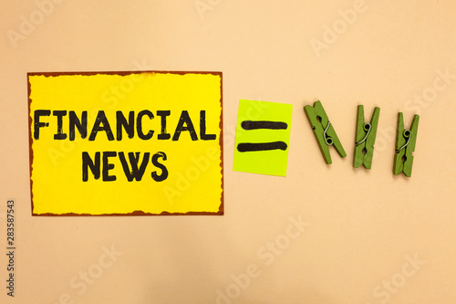 Word writing text Financial News. Business concept for Investment banking Fund management Regulation and trading Yellow piece paper reminder equal sign several clothespins sending message