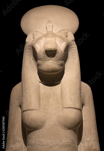 Statue of goddess Bastet, Bast or Sakhmet with lioness head and solar disk photo