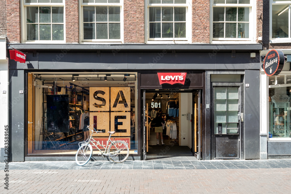 AMSTERDAM, THE NETHERLANDS - JULY 4, 2019: Levi's store. Levi's is brand of denim  jeans, owned by Levi Strauss & Co., an American clothing company. Stock  Photo | Adobe Stock