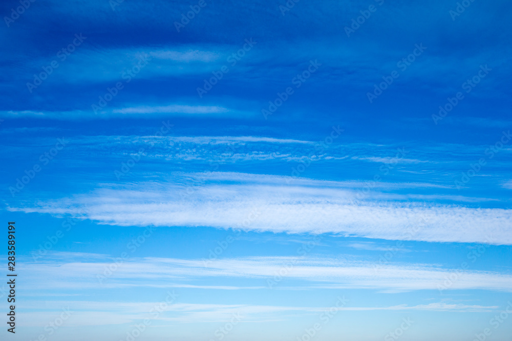Fototapeta premium blue sky background with tiny clouds